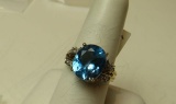 10K -yg- oval Helenite ring, size 7 1/2, weight 4.0, with 12 cubic zirconia