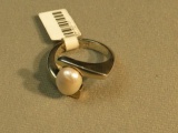 Sterling fresh water pearl ring in by-pass setting size 7 1/4, weight 8.5 g