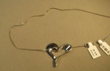 Sterling floating heart necklace on 16