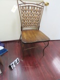 wrought iron framed chair with wood seat