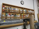aerosol spray can rack with used aerosol sprays, glues etc.  (buyer will have to remove from wall)