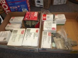Boxes of galvanized staples and brads for pneumatic gun.