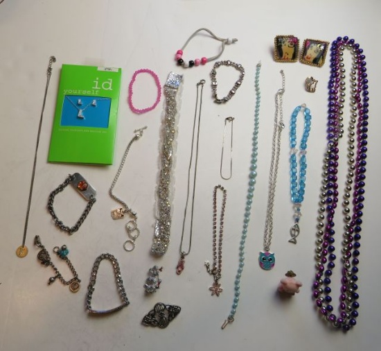 9 bracelets, 2 pins, 2 brooches, 1 head band, 8 necklaces, matching earring/necklace set, 1 pearced