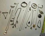 8 chain necklaces, 2 tie clasps, leather wrist belt  with conchos, 4 brooches, pin, 3 bracelets, 5 p