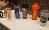 tote of mixed Gator water bottles and tumblers