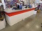 L shaped check out counter set up for two registers 140