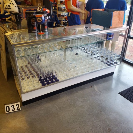Glass showcases very nice and clean 70" long x 20" deep x 38" high with sliding rear doors <br>merch