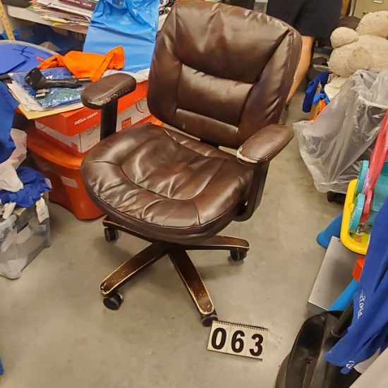 chrome framed office chair with brown vinyl upholstery (some worn and torn spots )