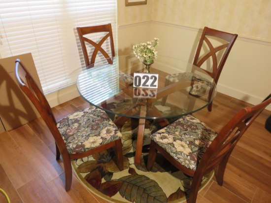 nook glass-top table with four upholstered chairs