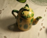 tea pot with a bee on it