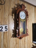 The Erie Regulator wall clock manufactured by Time Mfg. (note front glass has crack in lower left co