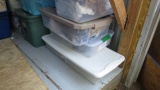 large group of 15 to 20 plastic totes some with clothing in them