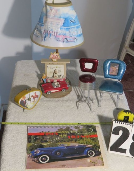 car-related collectibles, including calendar and lamp
