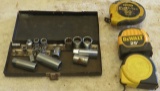 Variety of sockets and three measuring
