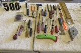 assorted tools:  screwdrivers, pliers, utility knife, etc.