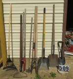 garden tools:  flat head shovels (2), post hole diggers (2) potato rake, leaf rake, hoe