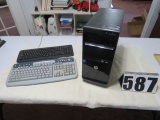 HP tower with two keyboards (HP and Targus)