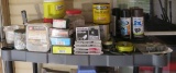 Contents of shelf, including some spray paint, brad nails, staples, nails, etc.