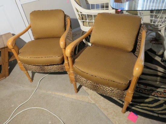 wood frame upholstered arm chairs with faux leopard and brown upholstery fabric