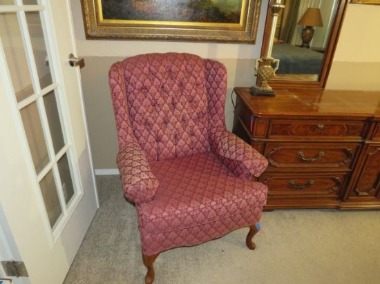 red upholstered wing back chair