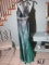 Gigi, size 8, emerald green dress with rhinestones. New with tags. Bust 37; Waist 29; Hips 40.