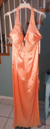 Xcite, size 10, halter style dress with sequins. Slit on the side. This one has a pick in the materi