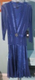 L Komaro formal dressv, Navy, fits size 10/12. Retails for 420.00 New with tags.