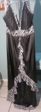 Gigi, size 12, black and white halter style dress. New with tags. Bust 40; Waist 32; Hips 43.