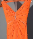 Xcite special occasion dress, size 2, sunny orange, halter style.  Some loose threads at the zipper.