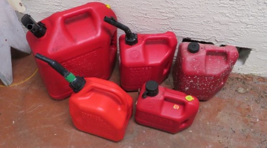 group of 5 red plastic gas cans 1 gal to 5 gal capacity