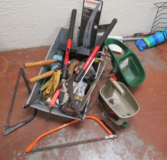 mixed yard and shrubbery tools in plastic tote
