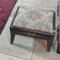 Metal foot stool with floral pattern cushion top