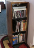 Rack of assorted CDs and DVDs with cases