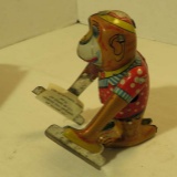 Wind up tin monkey with symbols toy  German made  no key