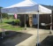 10' x 10' pop up tent with 4 concrete corner weights