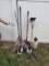 mixed assorted yard tools - rakes, square point shovel. Tamper, and other items