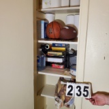 contents of closet at end of hall - basketball, football, 12 rolls of paper towels, small space heat