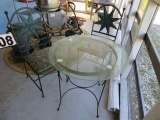 wrought iron table with glass top and 2 chairs