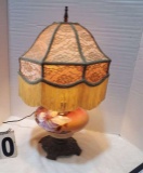 Victorian style globe lamp with vintage fringed shade