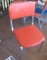 brushed aluminum dining chairs with red seats and backs