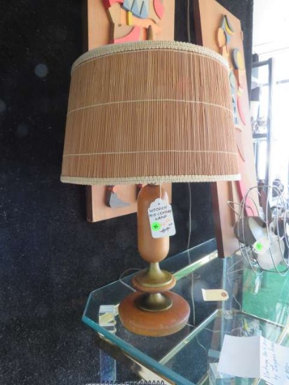 turned wood table lamp with wicker shade