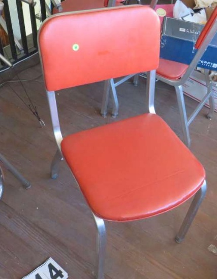 brushed aluminum dining chairs with red seats and backs