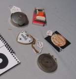 Geneva lense measurer, collapsible shot glass, Limoges heart, fire department button matches