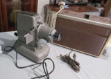 vintage slide projector  and Ansco Regent 60's movie projector with box of slide magazines