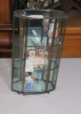 glass table top display cabinet with small figures