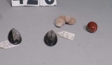 polshed fossil paper weights, polished agate egg, petrified sea urchin