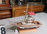 wood model sport  sedan fishing boat (one outrigger needs reattaching)