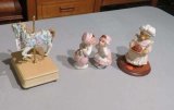 kissing figurines, carousel horse and bear with pie