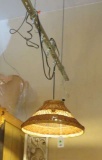 Straw shaded swag lamp