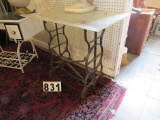 Repurposed treadle sewing machine base with a plexiglass top